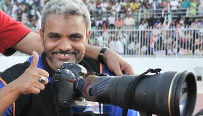 الفيفا يختار المصور اليمني عبدالعزيز عمر لتغطية مباريات كأس العالم بالبرازيل